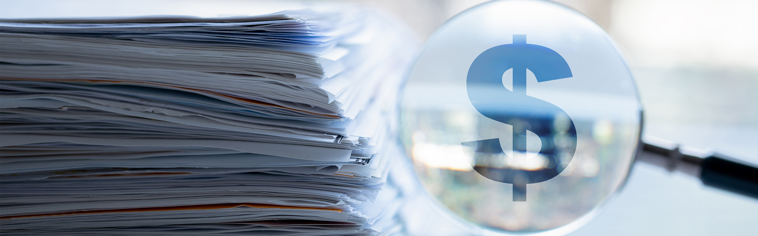 Magnifying Glass and Stack of Paper